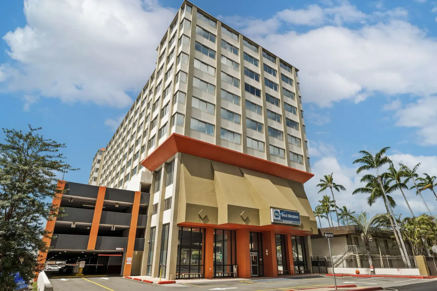 Exterior tower and entrance of Best Western The Plaza Hotel Honolulu Airport.