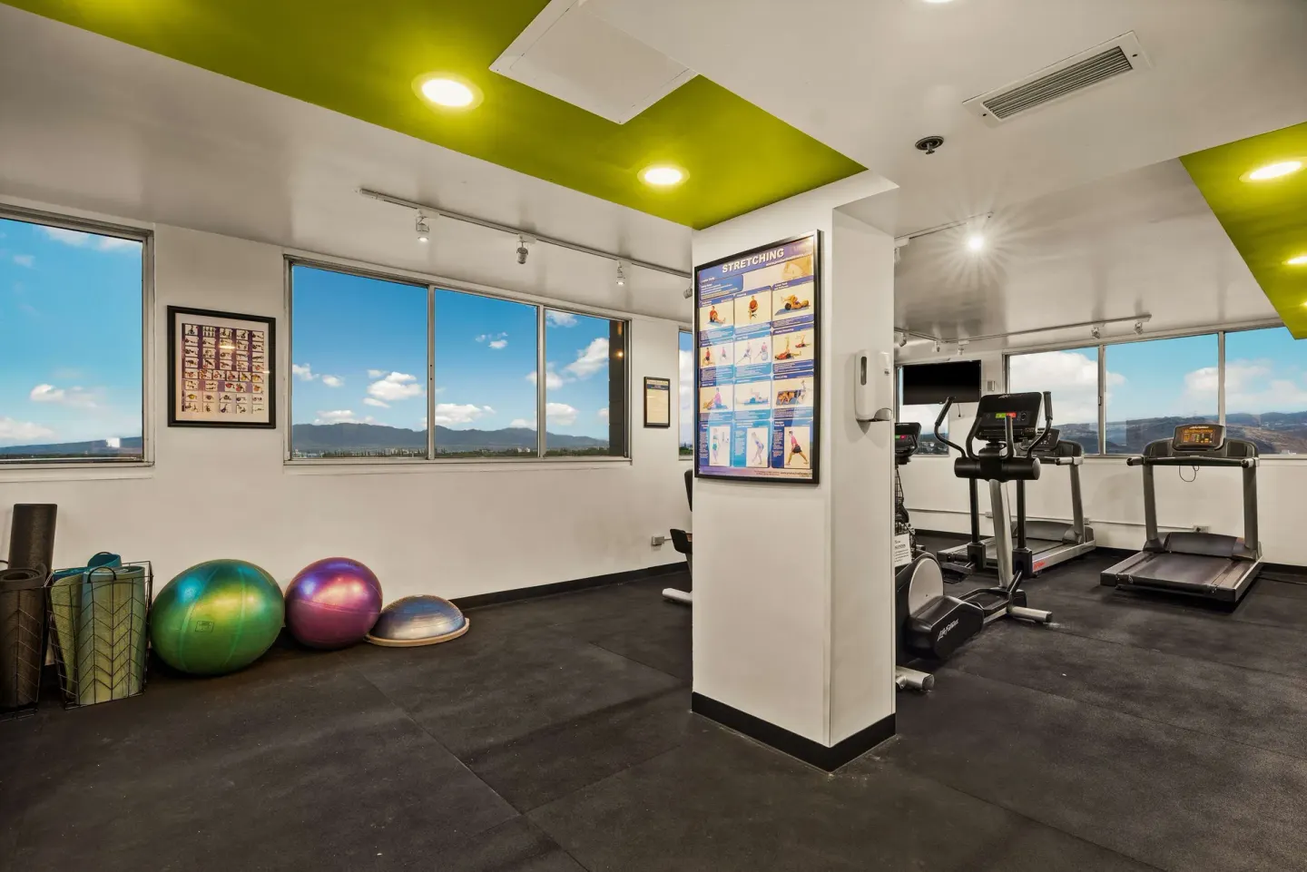 Fitness room with treadmills and exercise balls at Best Western The Plaza Hotel Honolulu Airport.
