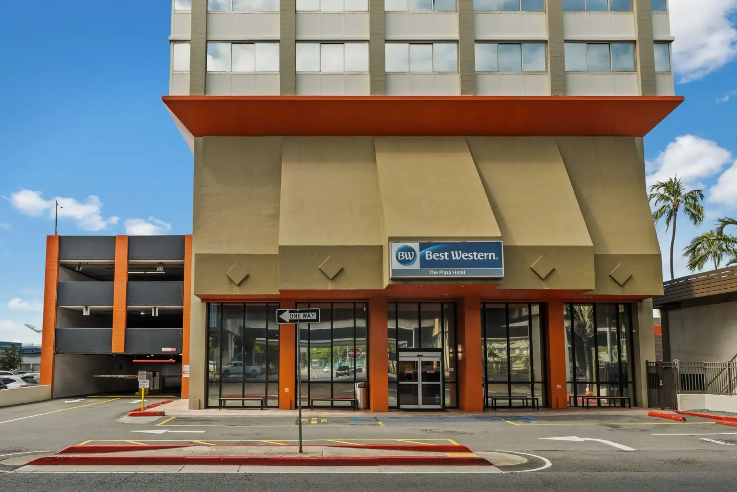 Front entrance and hotel sign at Best Western The Plaza Hotel Honolulu Airport.