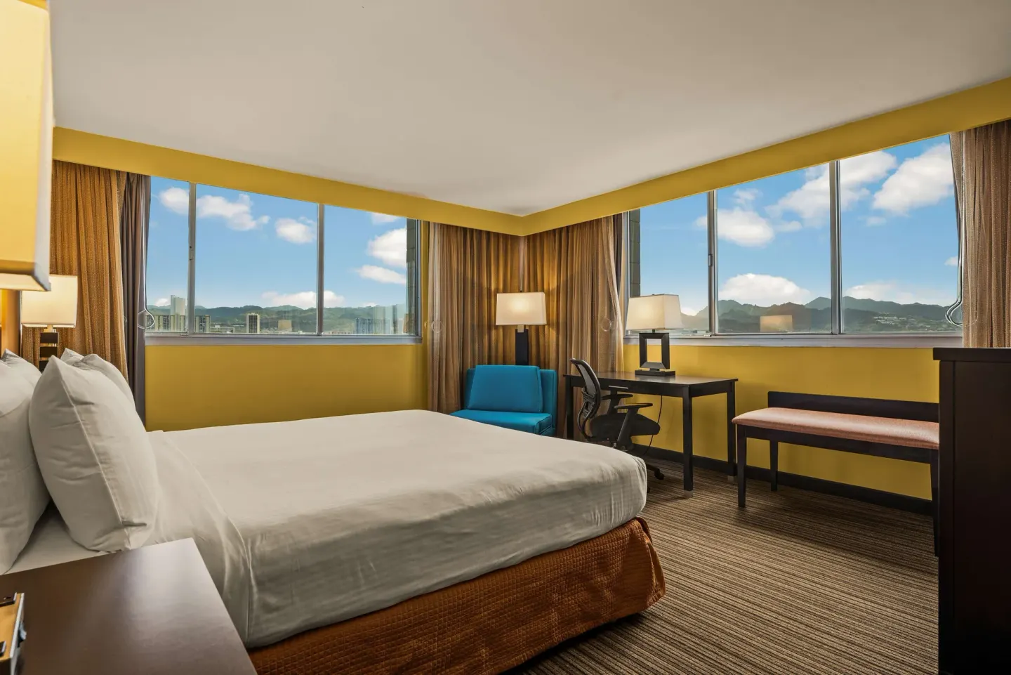 King bed guest room with large windows at Best Western The Plaza Hotel Honolulu Airport.
