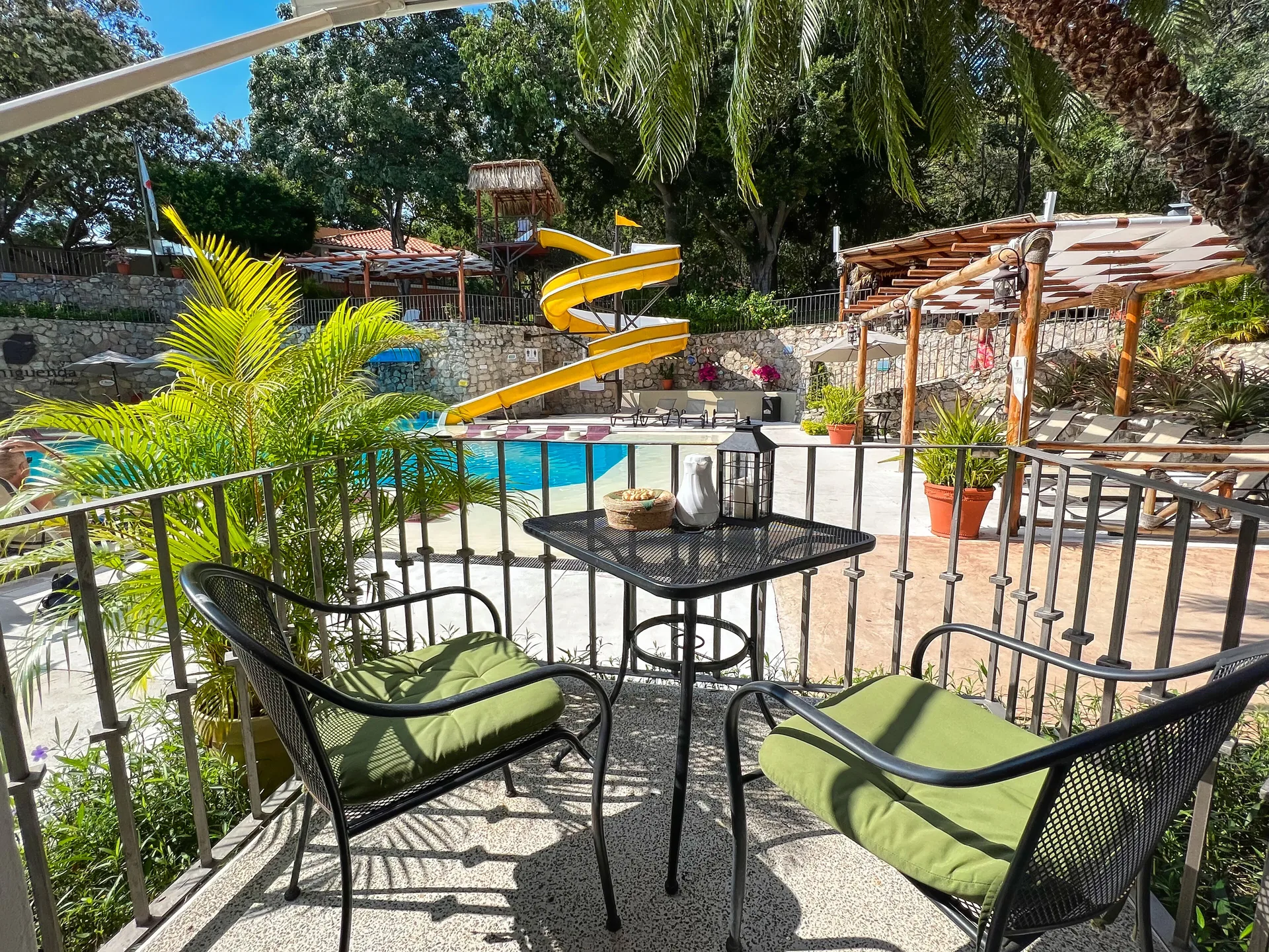 Select Room at Binniguenda Huatulco and Beach Club with balcony seating, pool view, and contemporary design in Huatulco, Oaxaca.