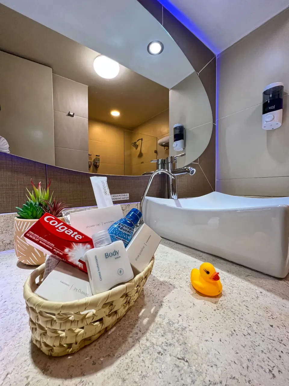 Select Room bathroom vanity with sink and amenities at Binniguenda Huatulco & Beach Club.