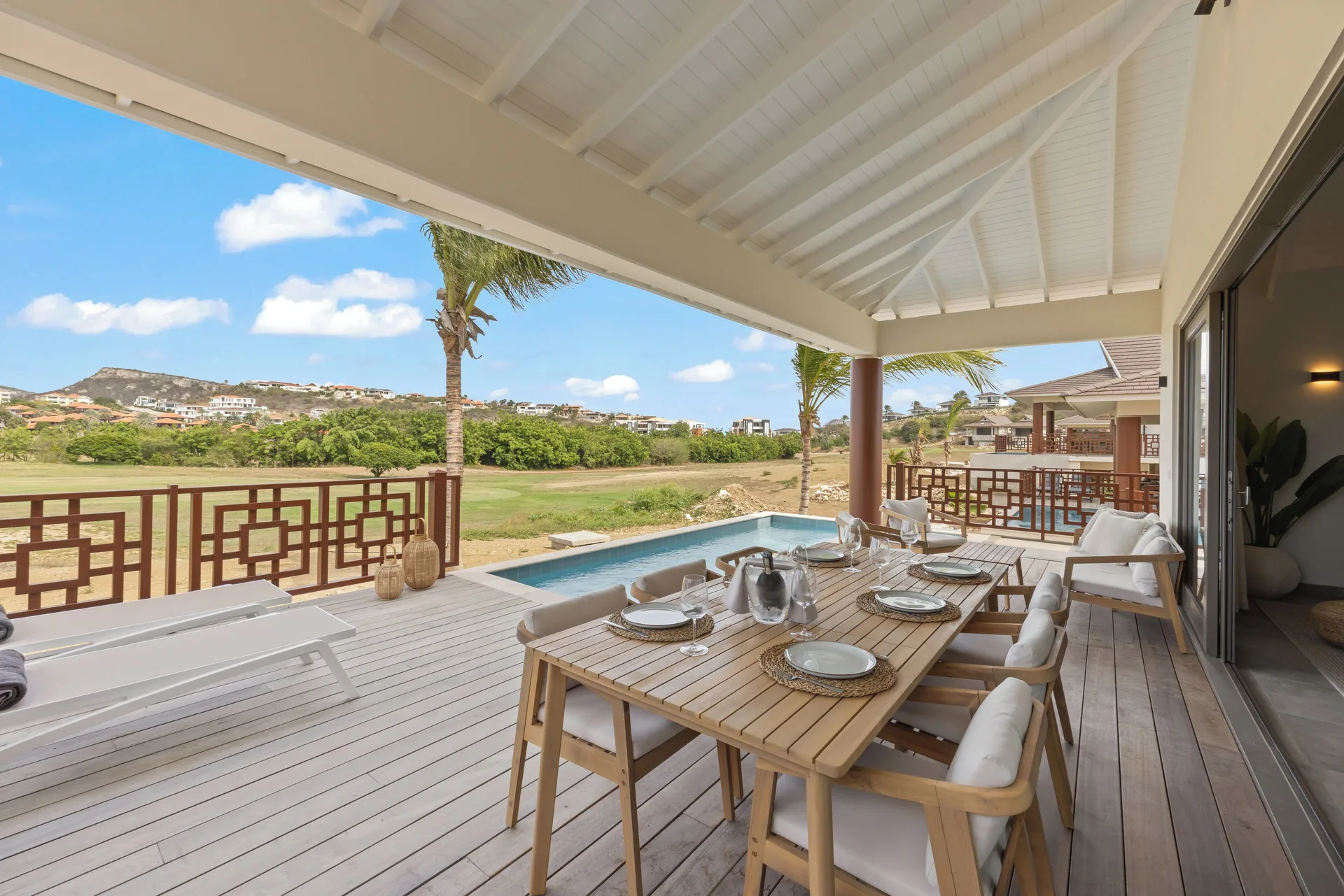 Covered terrace dining table and plunge pool at Blue Bay Curacao Golf & Beach Resort.