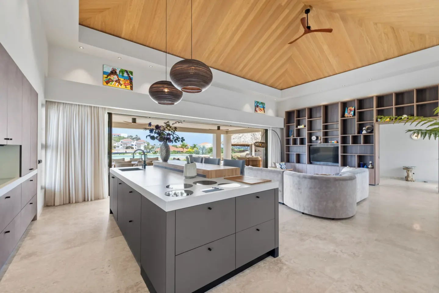 Open villa kitchen and living area with terrace at Blue Bay Curacao Golf & Beach Resort.