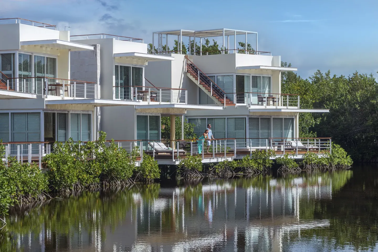 Lagoon-side resort building with balconies at Blue Diamond Luxury Boutique.