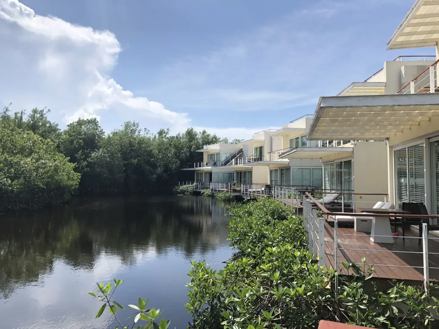 Lagoon-side resort buildings with private decks at Blue Diamond Luxury Boutique.