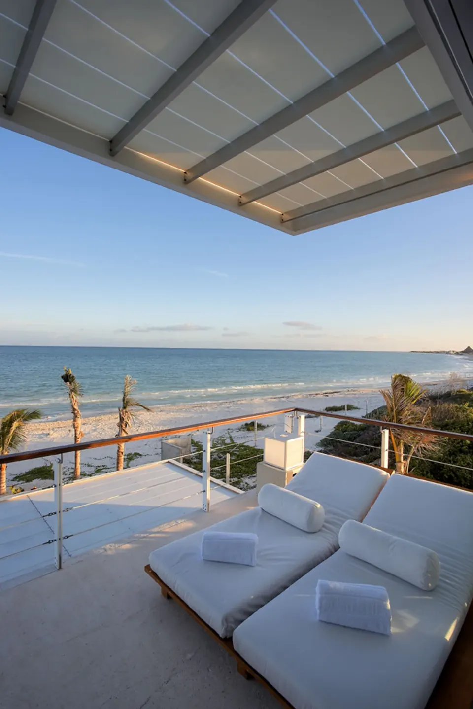 Ocean-view terrace with double daybed at Blue Diamond Luxury Boutique.