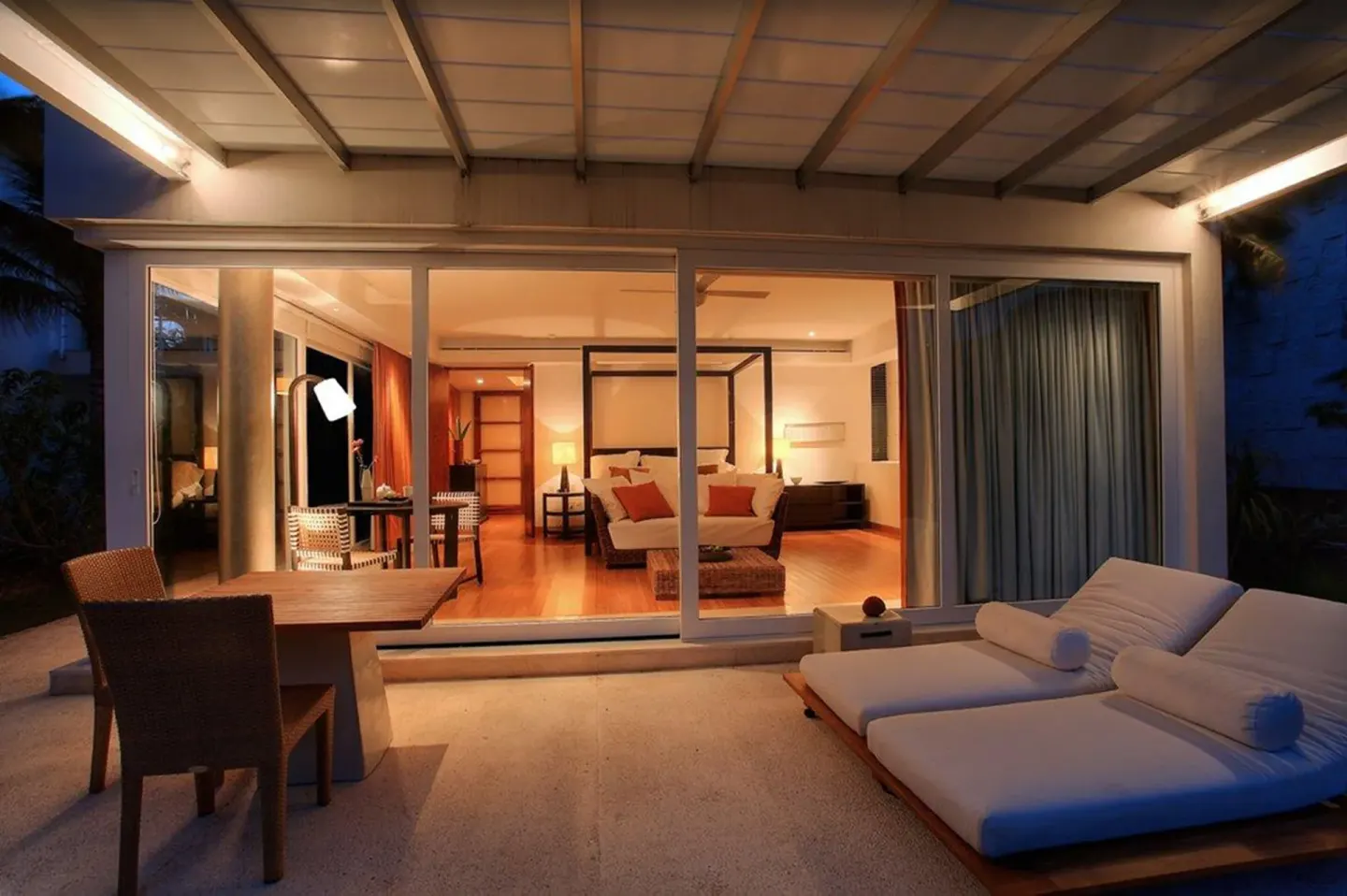 Cenote Lagoon Deluxe Junior Suite terrace and king bed at night at Blue Diamond Luxury Boutique.