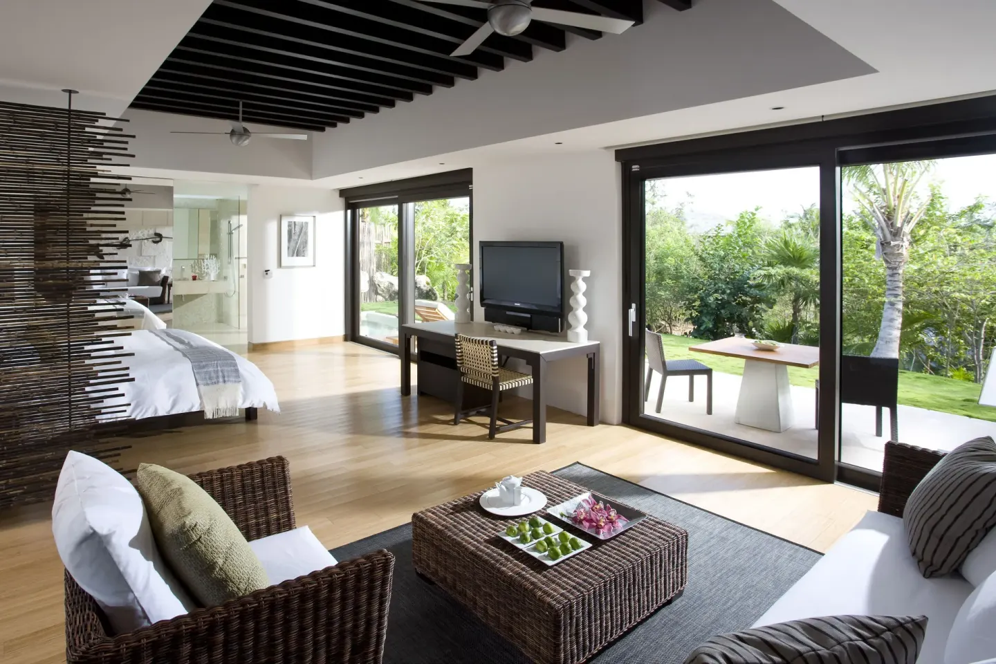 Junior Suite Patio living area and bed with garden patio at Blue Diamond Luxury Boutique.