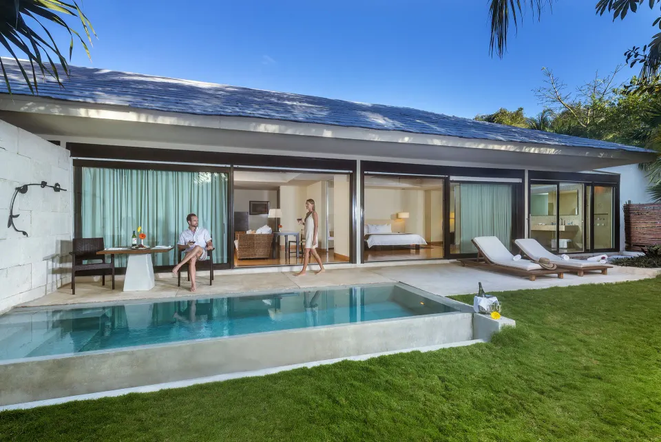 Patio Diamond Suite poolside terrace with guests and open suite views at Blue Diamond Luxury Boutique.