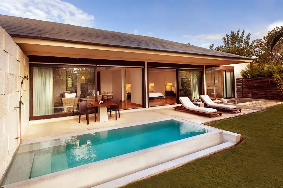 Patio Diamond Suite terrace with pool, loungers, and rooms behind glass at Blue Diamond Luxury Boutique.