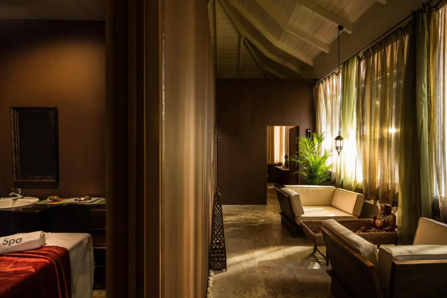 Spa treatment room and lounge seating at BlueBay Villas Doradas.