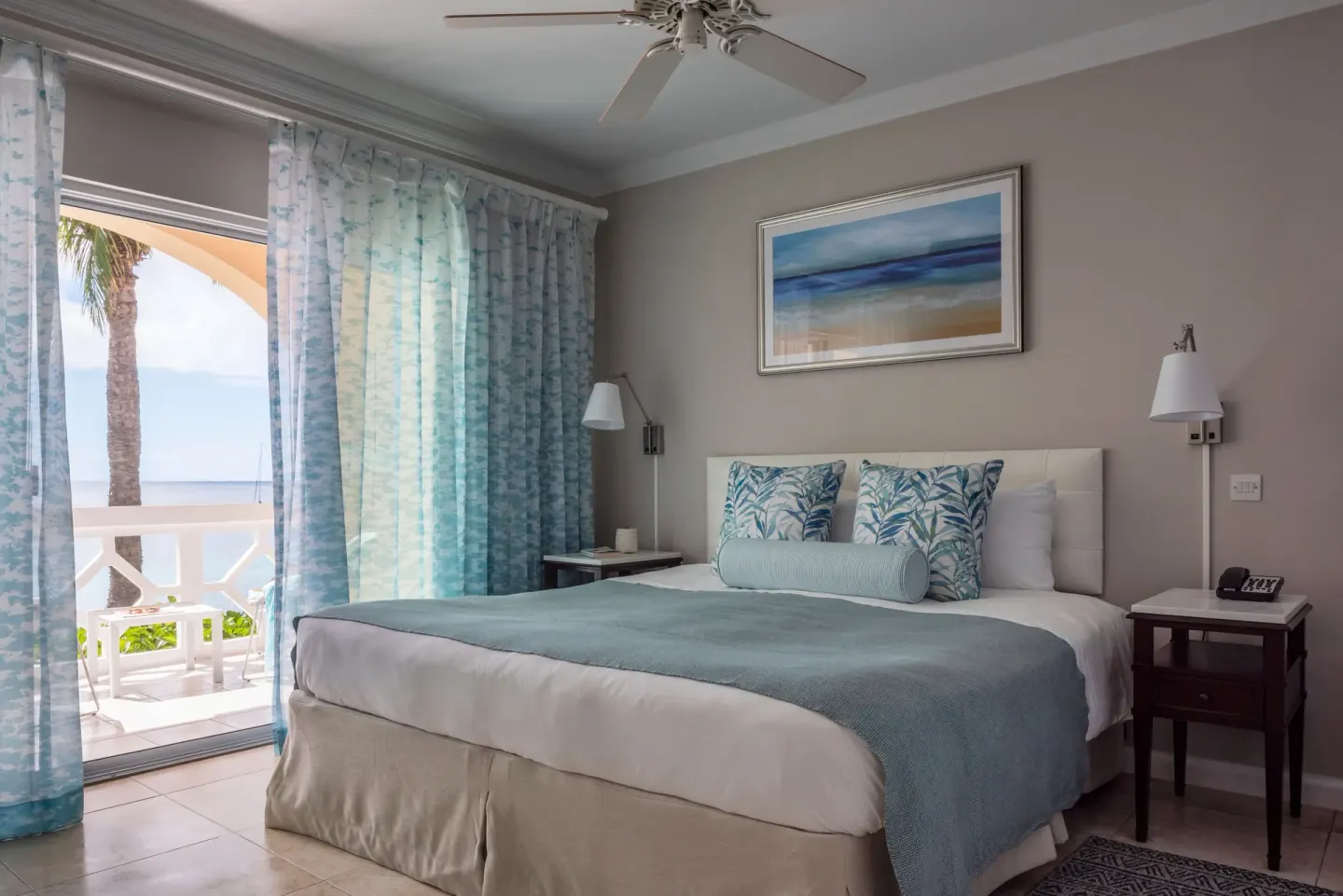 King bed guest room with balcony and partial sea view at BodyHoliday.