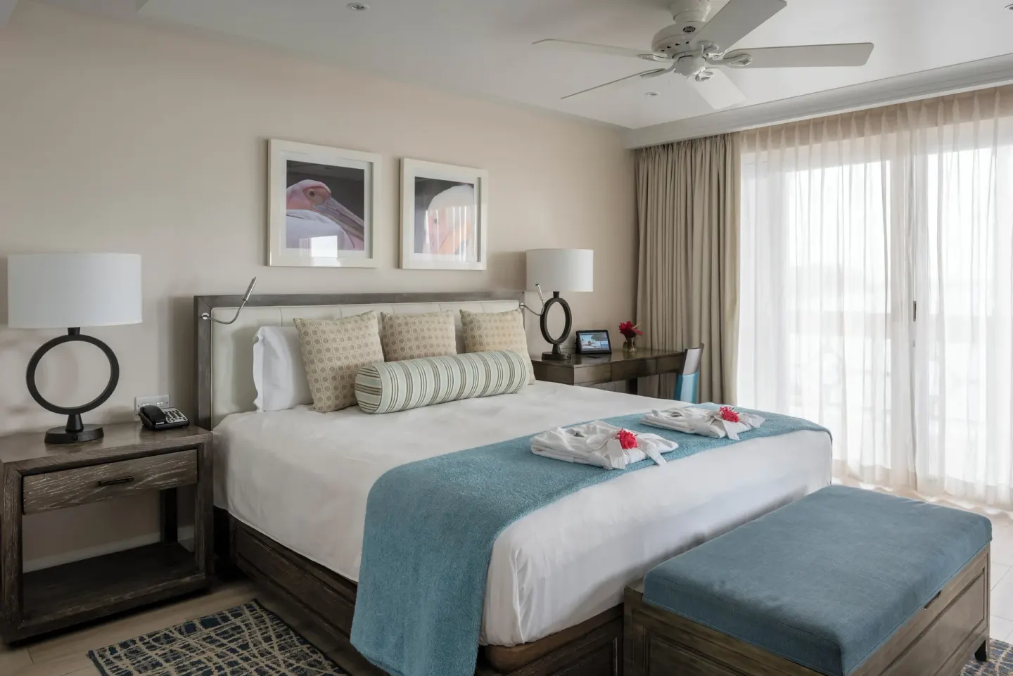 Junior Studio Suite Oceanfront king bed and balcony doors at BodyHoliday.