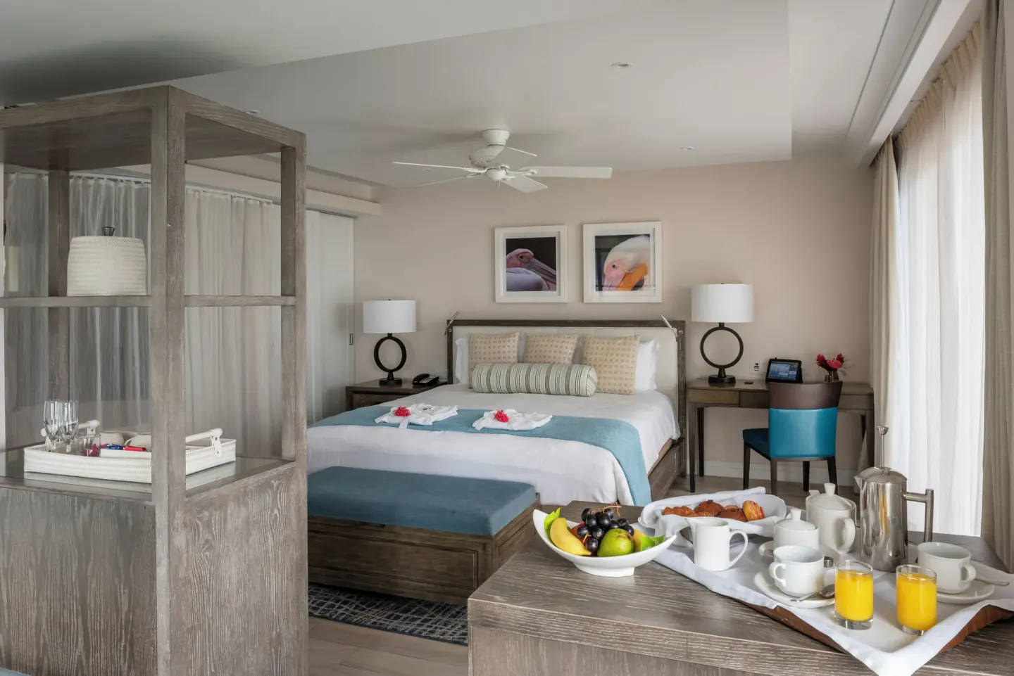 Junior Studio Suite Oceanfront bedroom with breakfast tray at BodyHoliday.