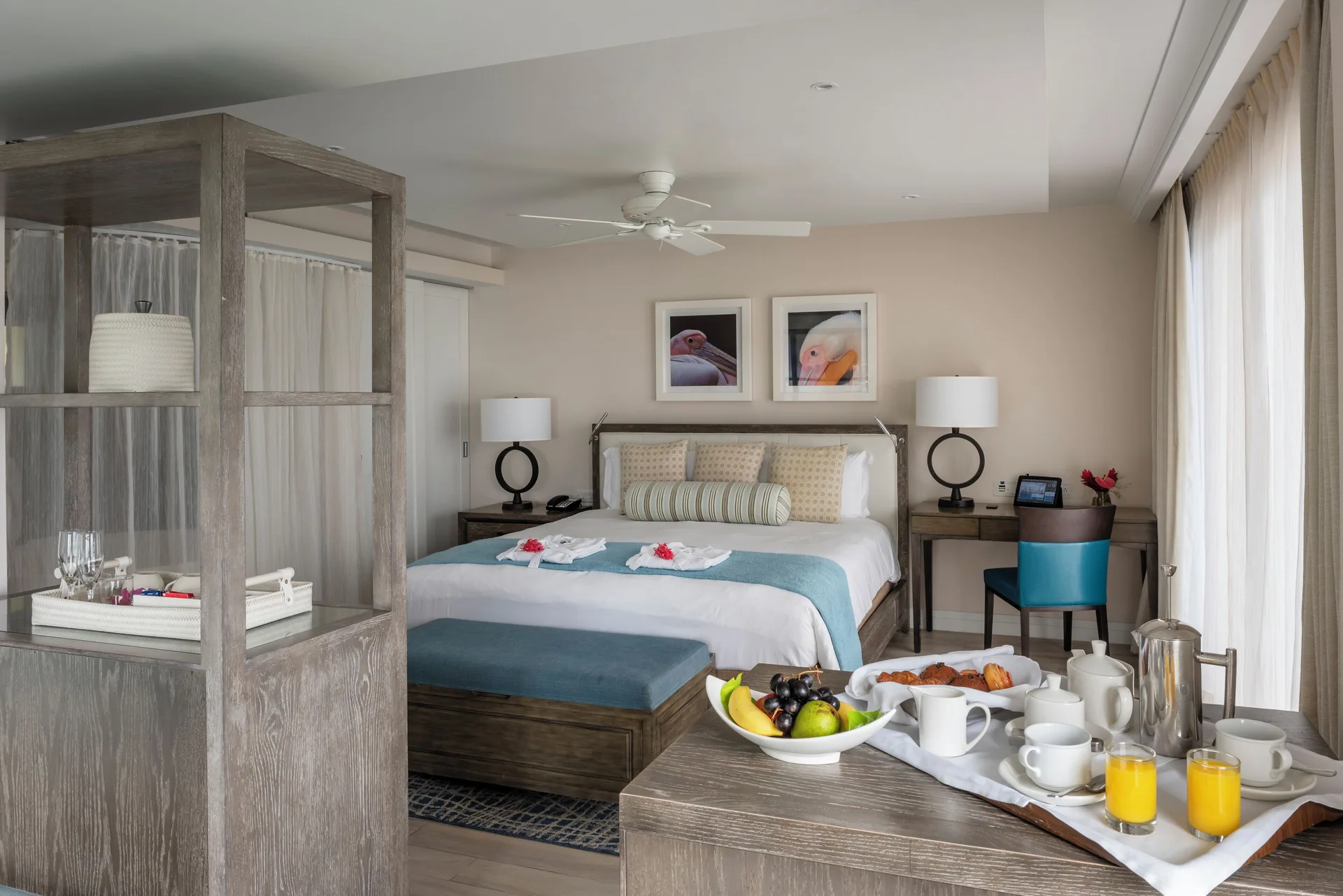 Junior Studio Suite Oceanfront bedroom with breakfast tray at BodyHoliday.