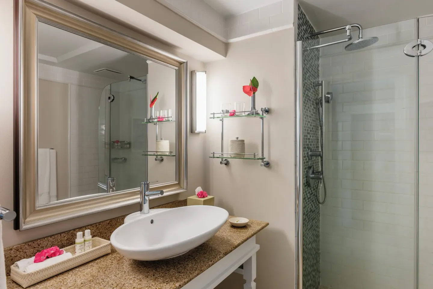 Bathroom in a Garden View room at BodyHoliday with vessel sink, mirror, and glass shower.