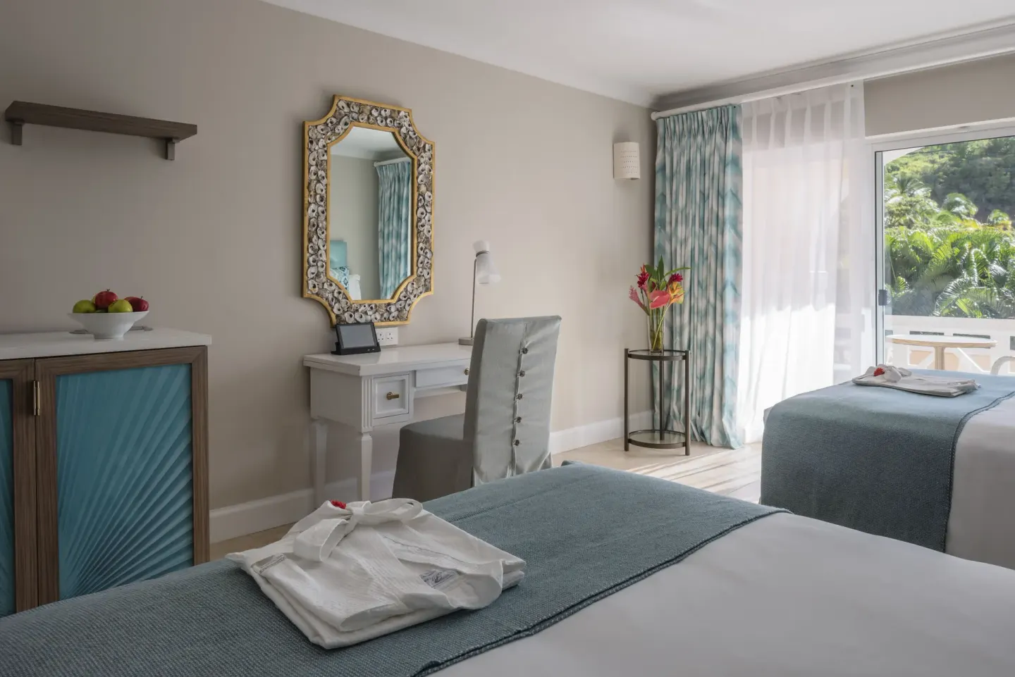 Garden View room at BodyHoliday with twin beds, desk, mirror, and balcony greenery.