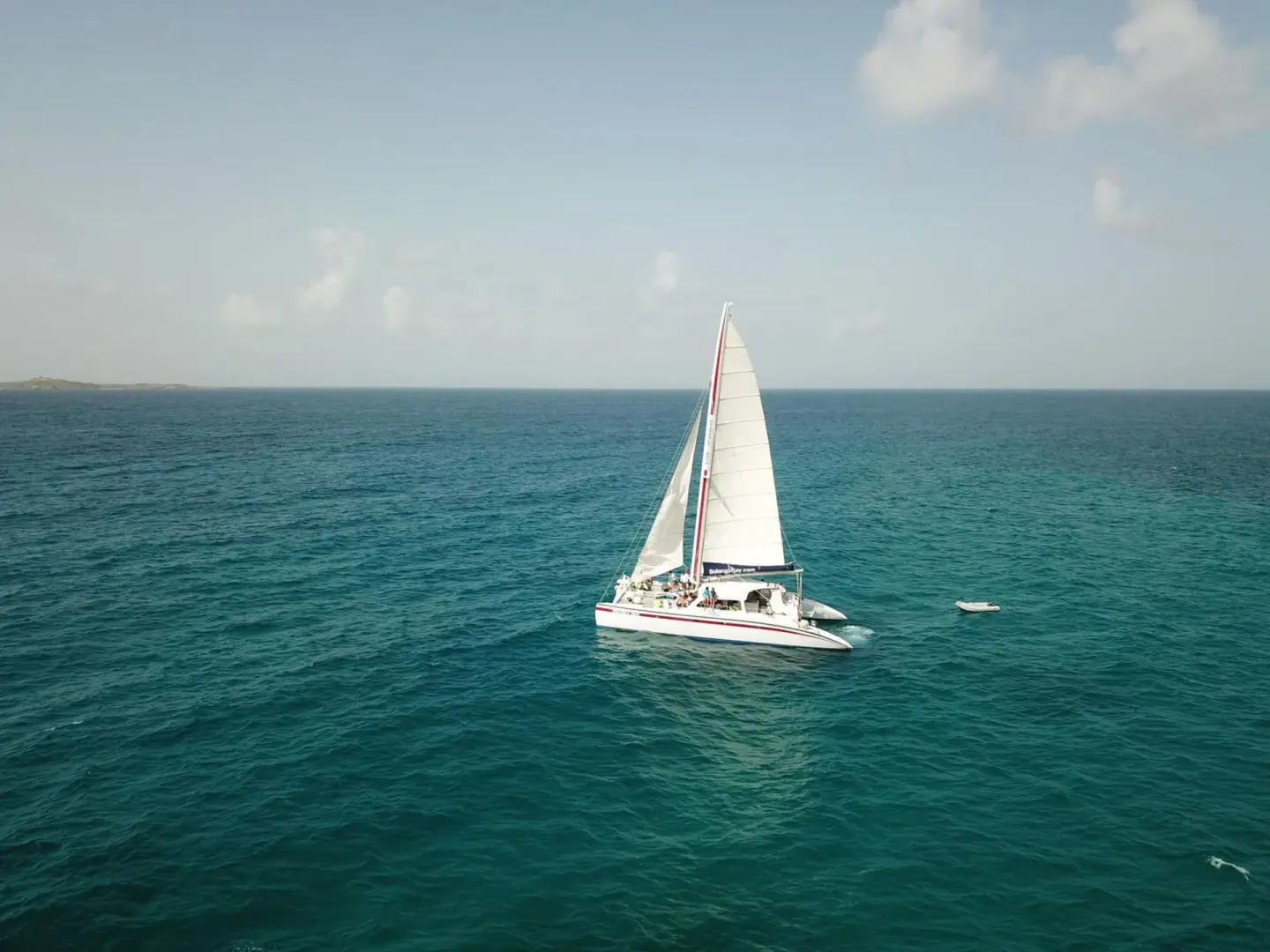 Sailboat on turquoise water near Bolongo Bay Beach Resort.