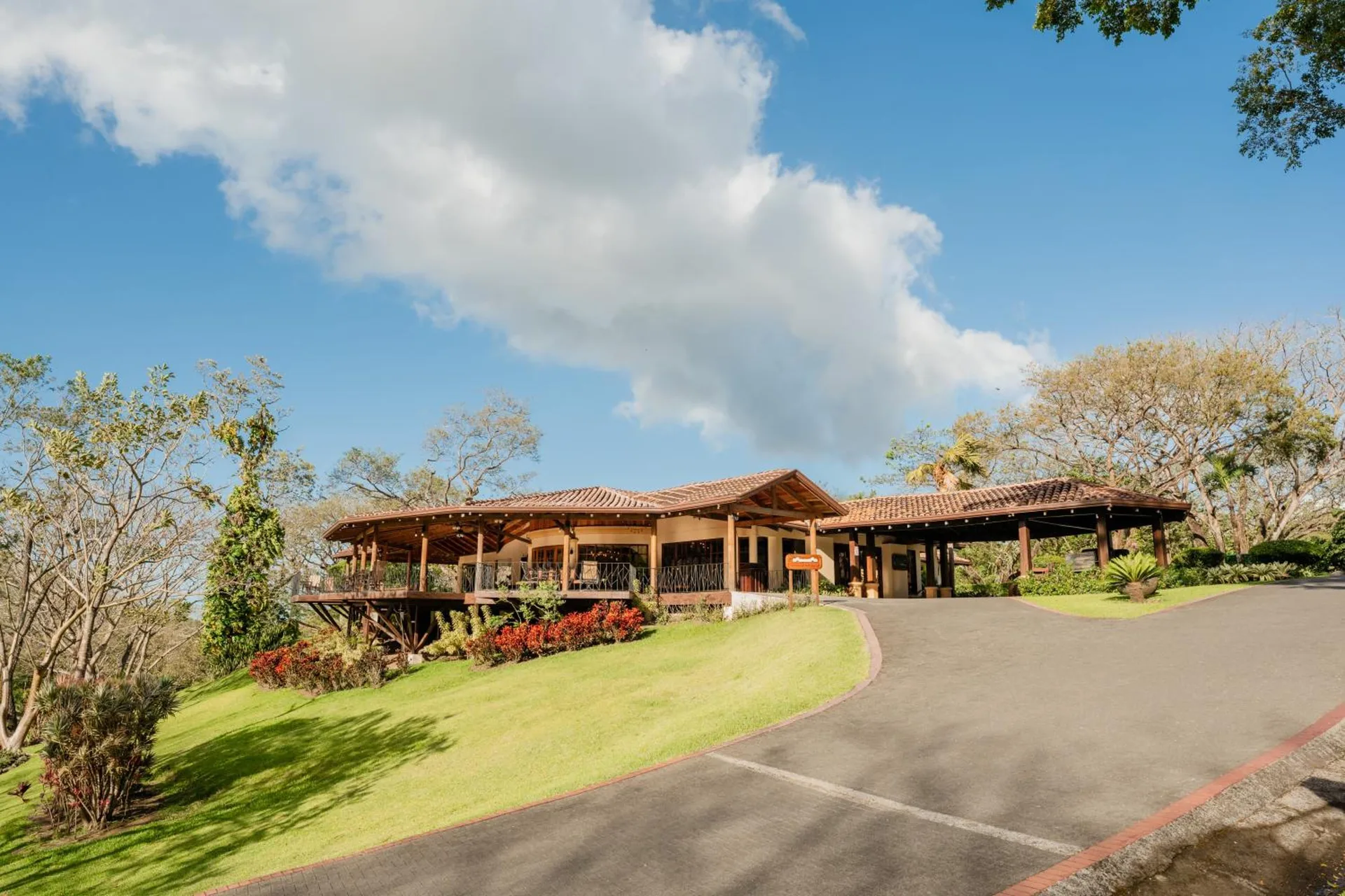 Open-air resort building and driveway at Borinquen Thermal Resort.