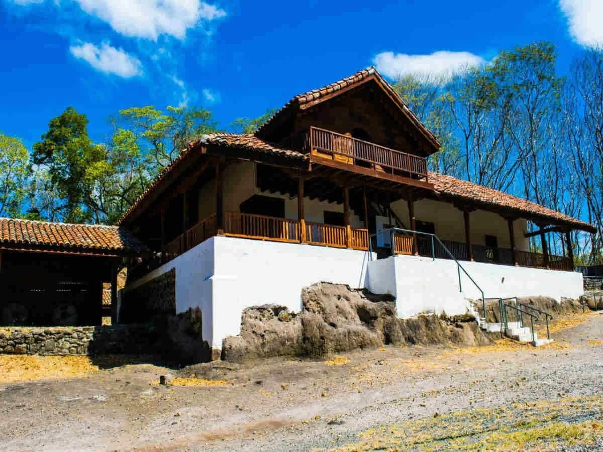 Two-story rustic building with balconies at Borinquen Thermal Resort.