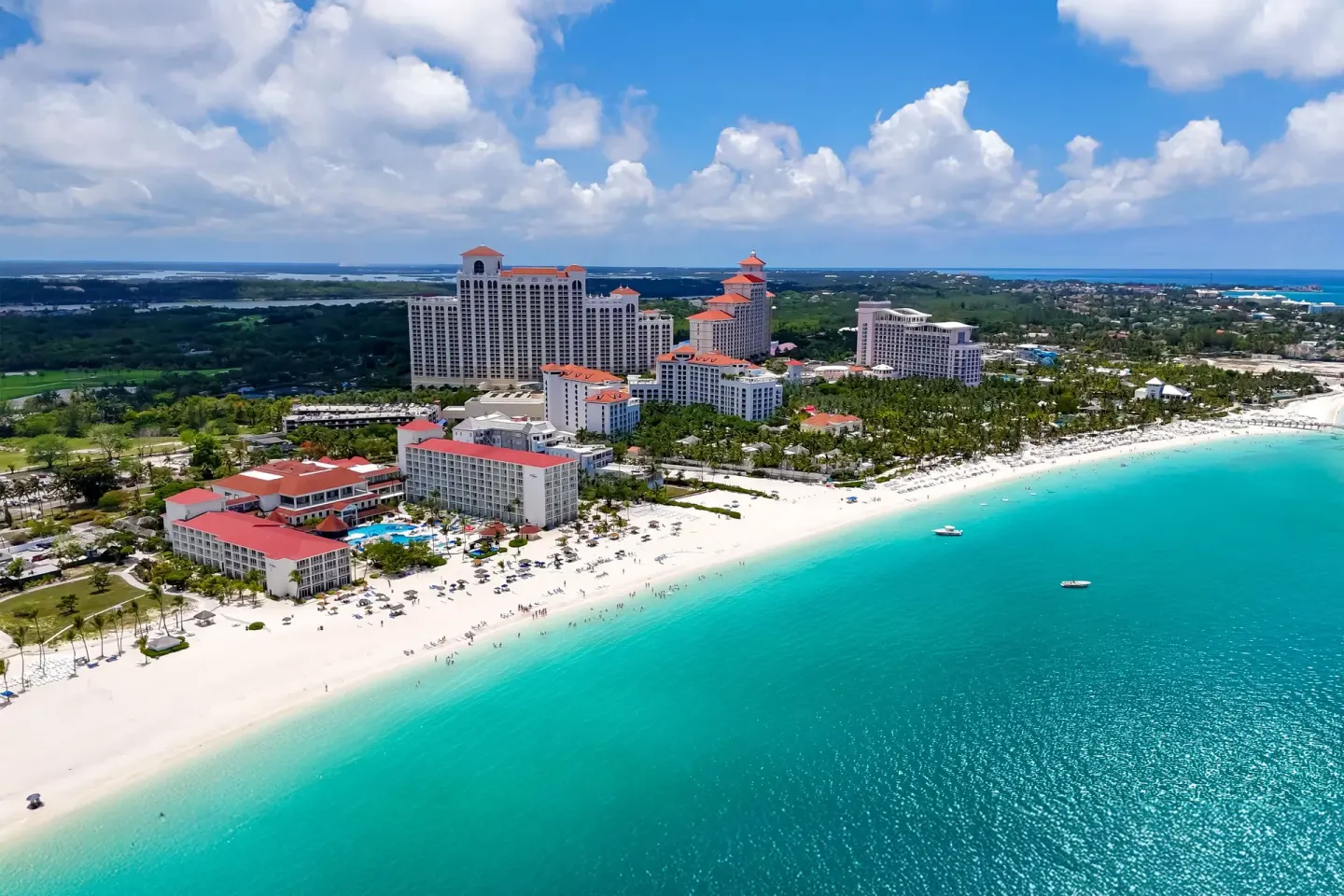 Aerial view of the beachfront and turquoise water at Breezes Resort Bahamas.