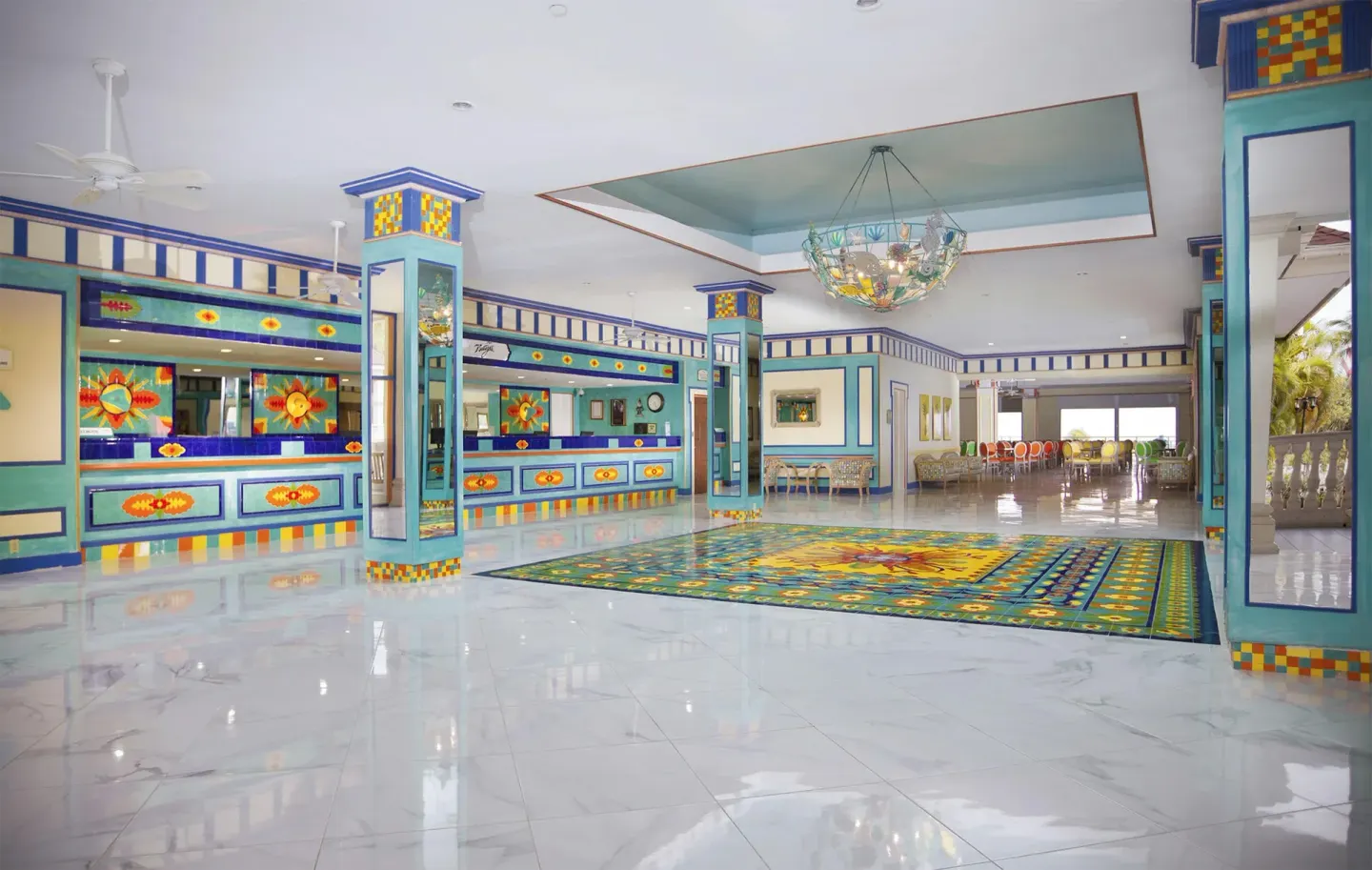 Colorful lobby with patterned columns and glossy floors at Breezes Resort Bahamas.
