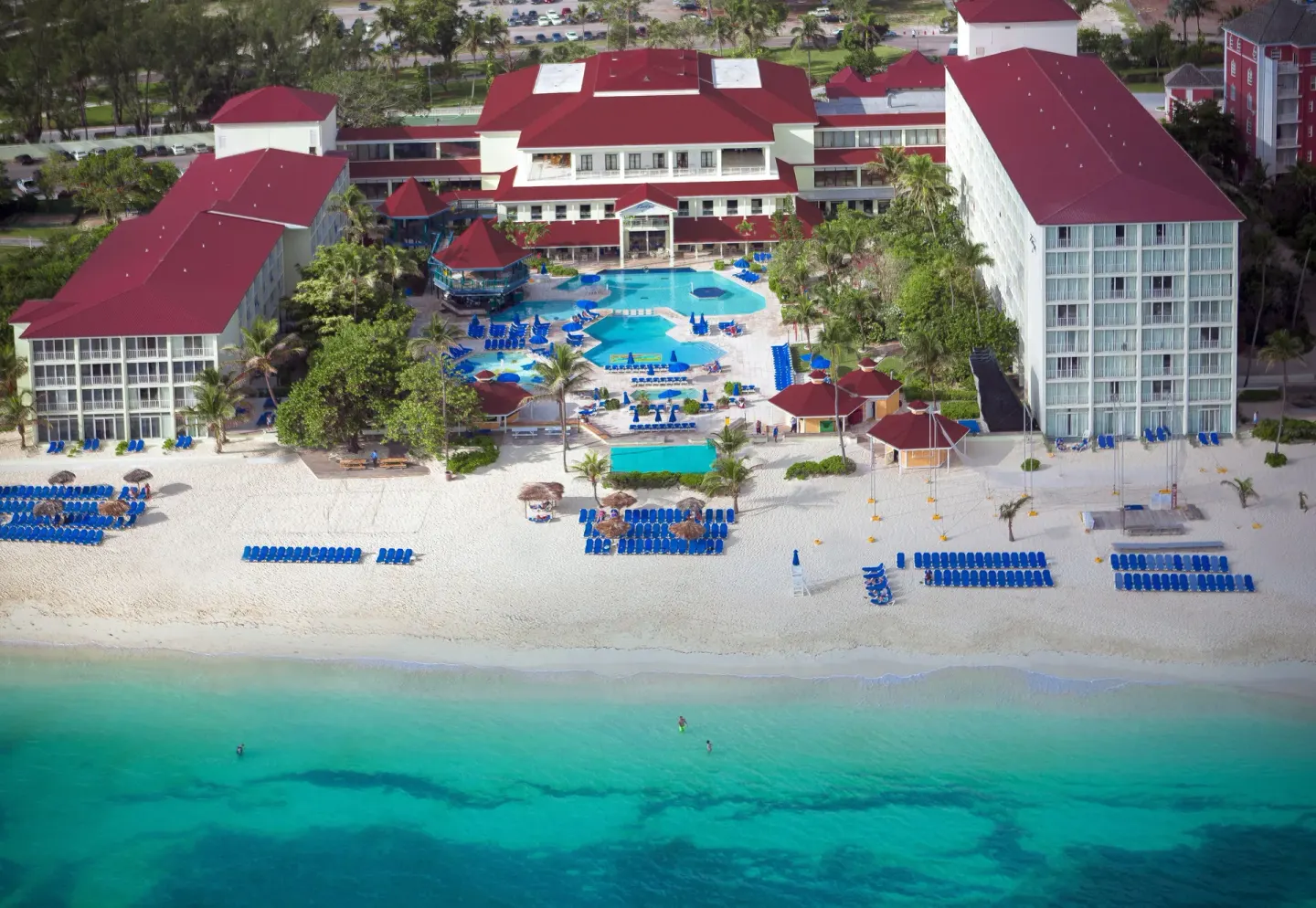 Overhead view of the pool, beach, and resort buildings at Breezes Resort Bahamas.