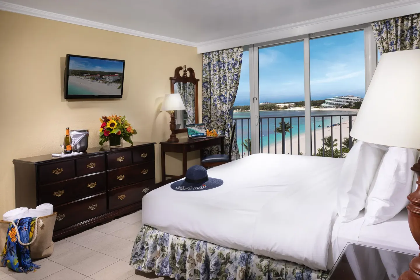 Partial Ocean View Room with king bed and beach-facing balcony at Breezes Resort Bahamas.