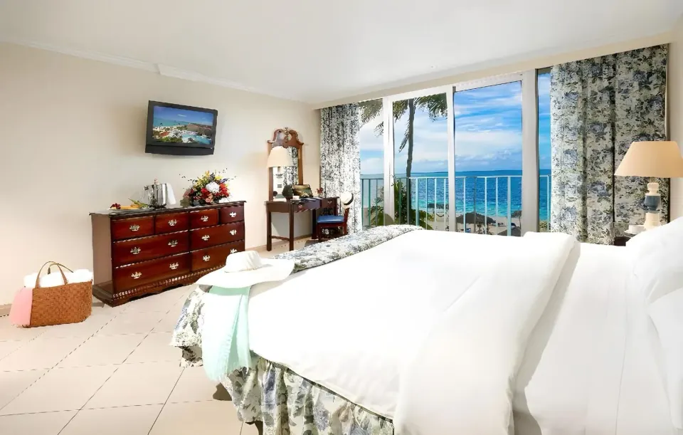 Partial Ocean View Room with king bed and balcony at Breezes Resort Bahamas
