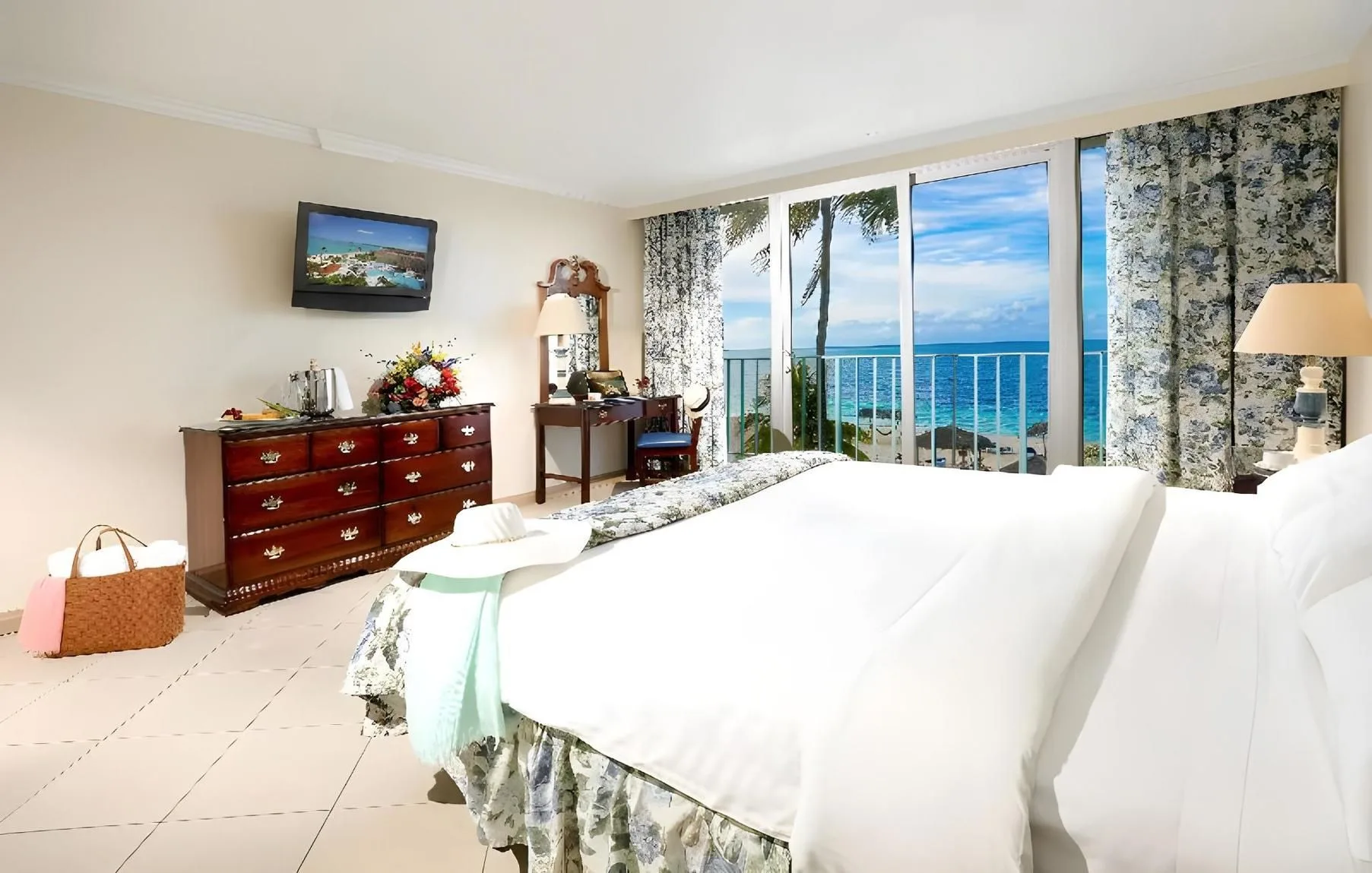 Partial Ocean View Room with king bed and balcony at Breezes Resort Bahamas