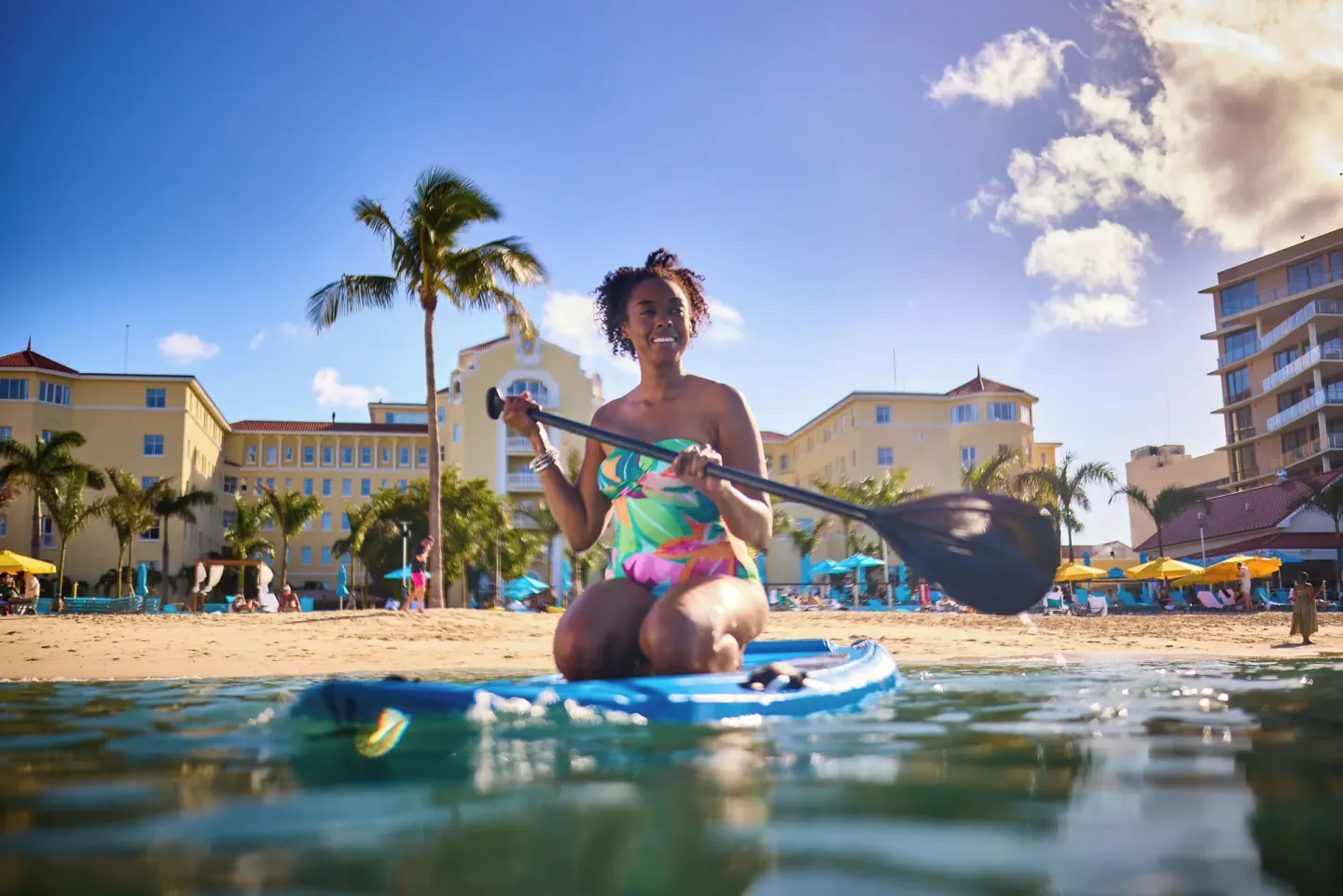Paddleboarder on the water in front of British Colonial Nassau.