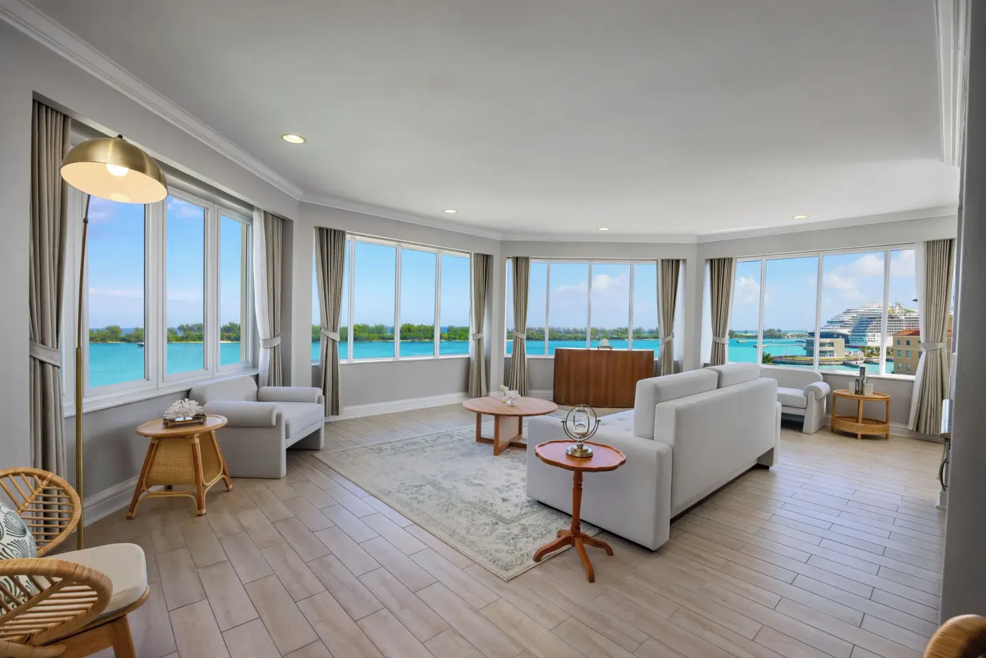Corner living room with sofas and harbor windows at British Colonial Nassau.