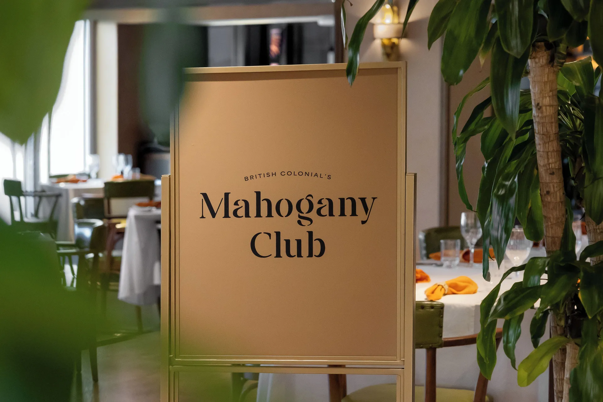 Mahogany Club sign beside a dining room at British Colonial Nassau.