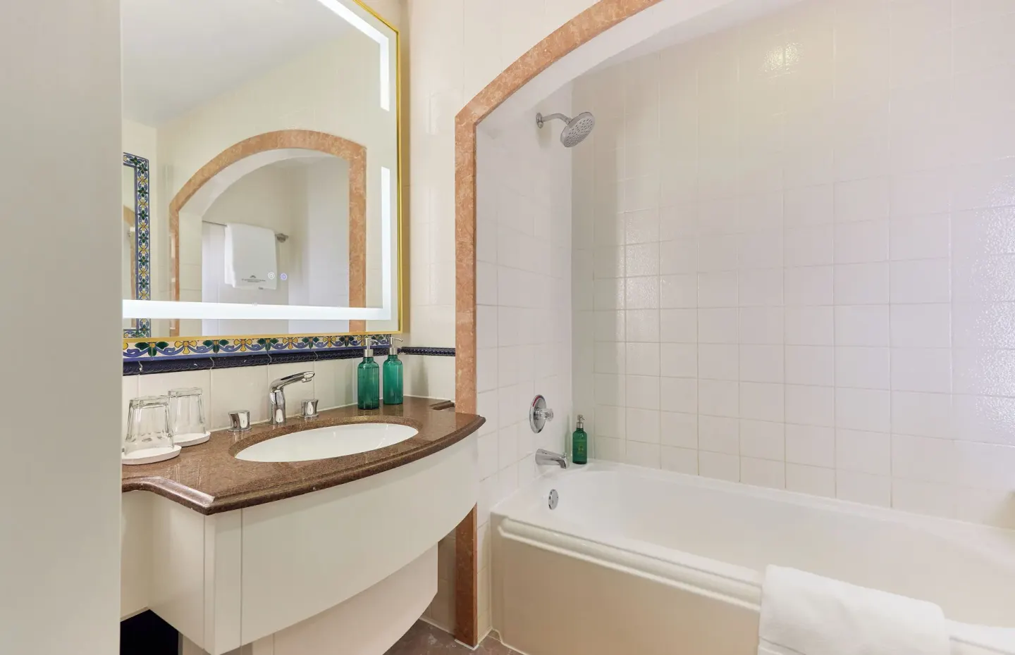 City View Suite bathroom with tub, shower and vanity at British Colonial Nassau.