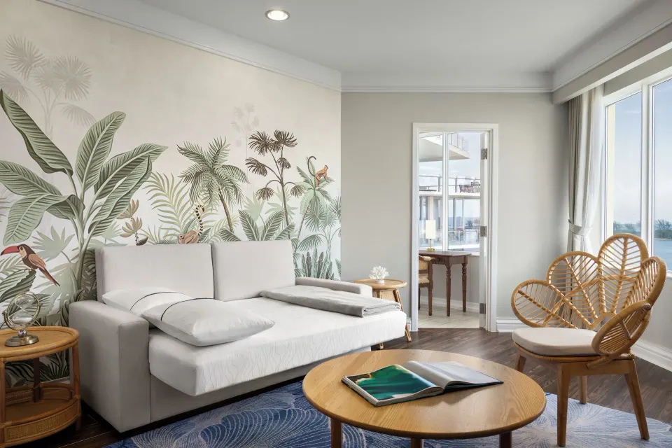 Premium Suite Ocean View sitting room with sofa and tropical mural at British Colonial Nassau.