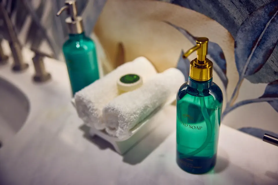 Standard Room bathroom amenities and rolled towel at British Colonial Nassau.