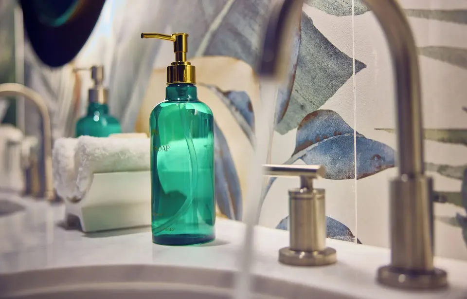 Standard Room sink with teal soap bottle and faucet at British Colonial Nassau.