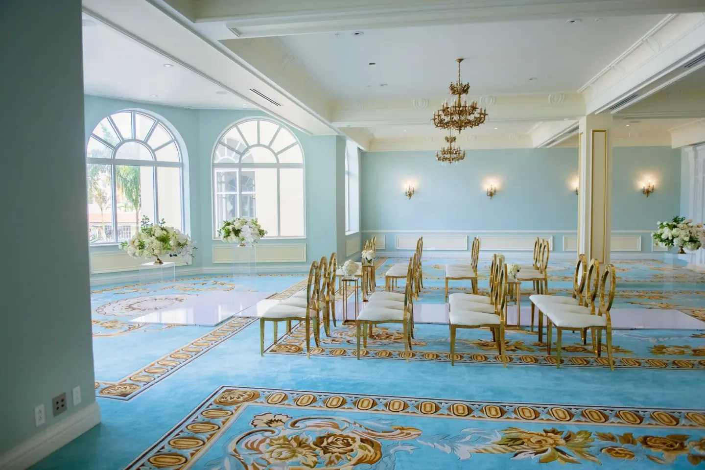 Light blue event room set with gold chairs at British Colonial Nassau.