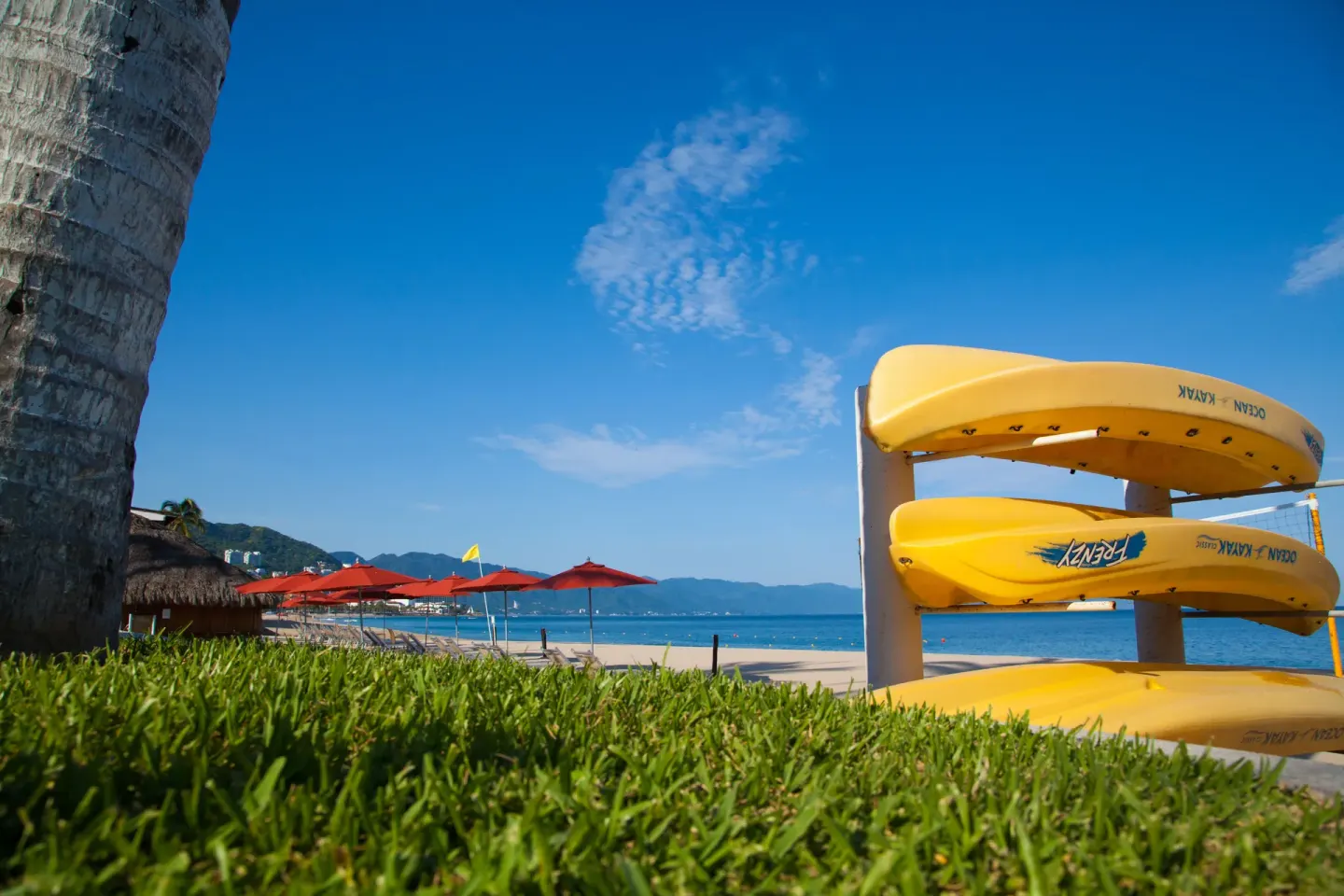 Stacked yellow kayaks beside the beach at Buenaventura Grand Hotel & Great Moments.