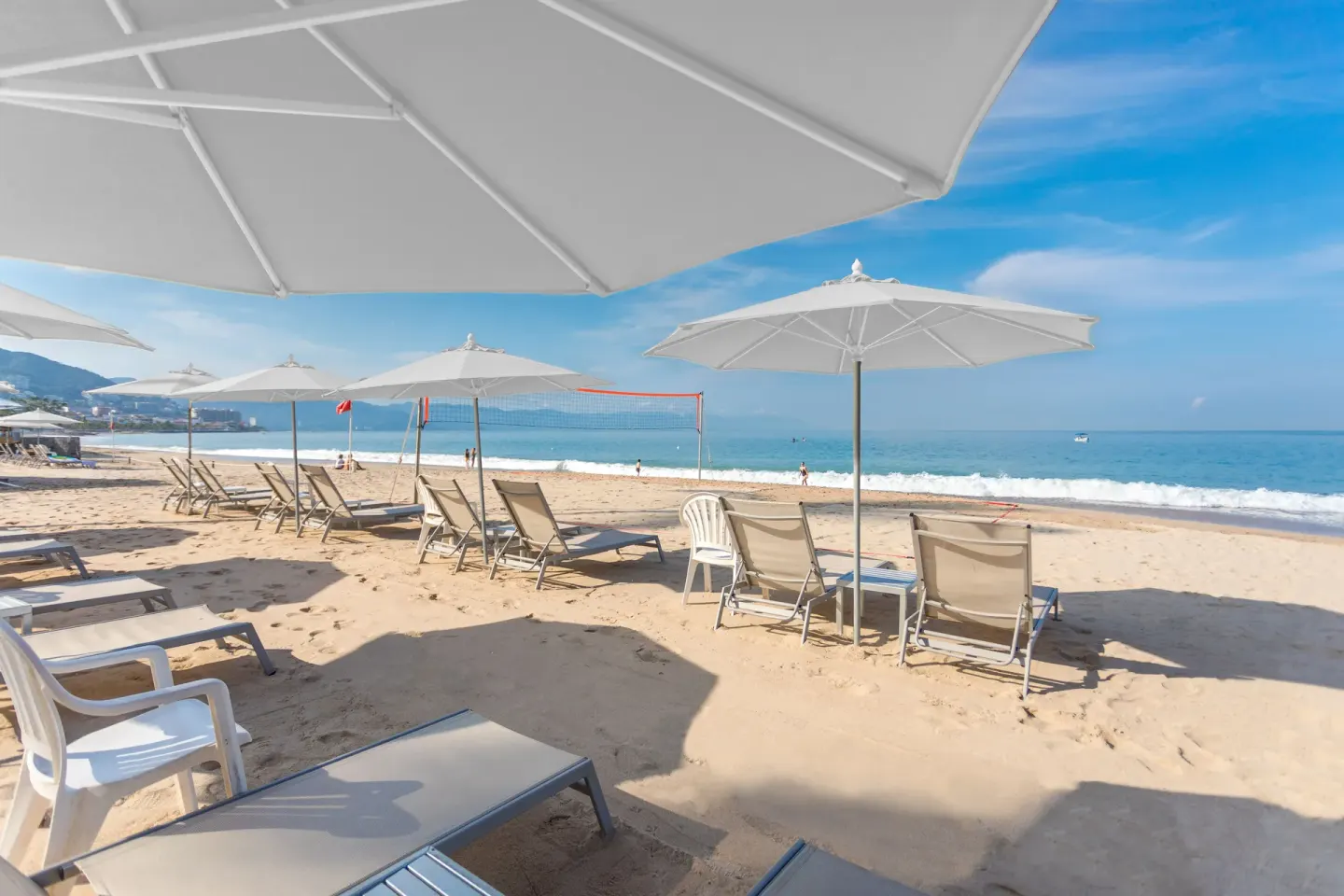 Beach loungers and umbrellas at Buenaventura Grand Hotel & Great Moments facing the ocean.