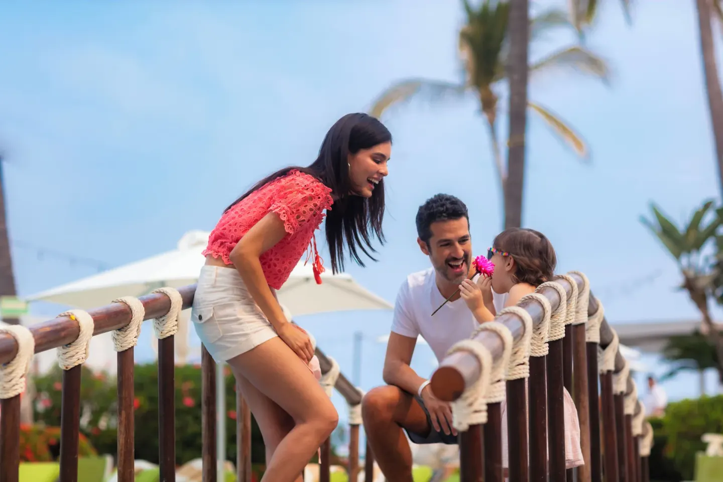 Family on a wooden garden bridge at Buenaventura Grand Hotel & Great Moments.