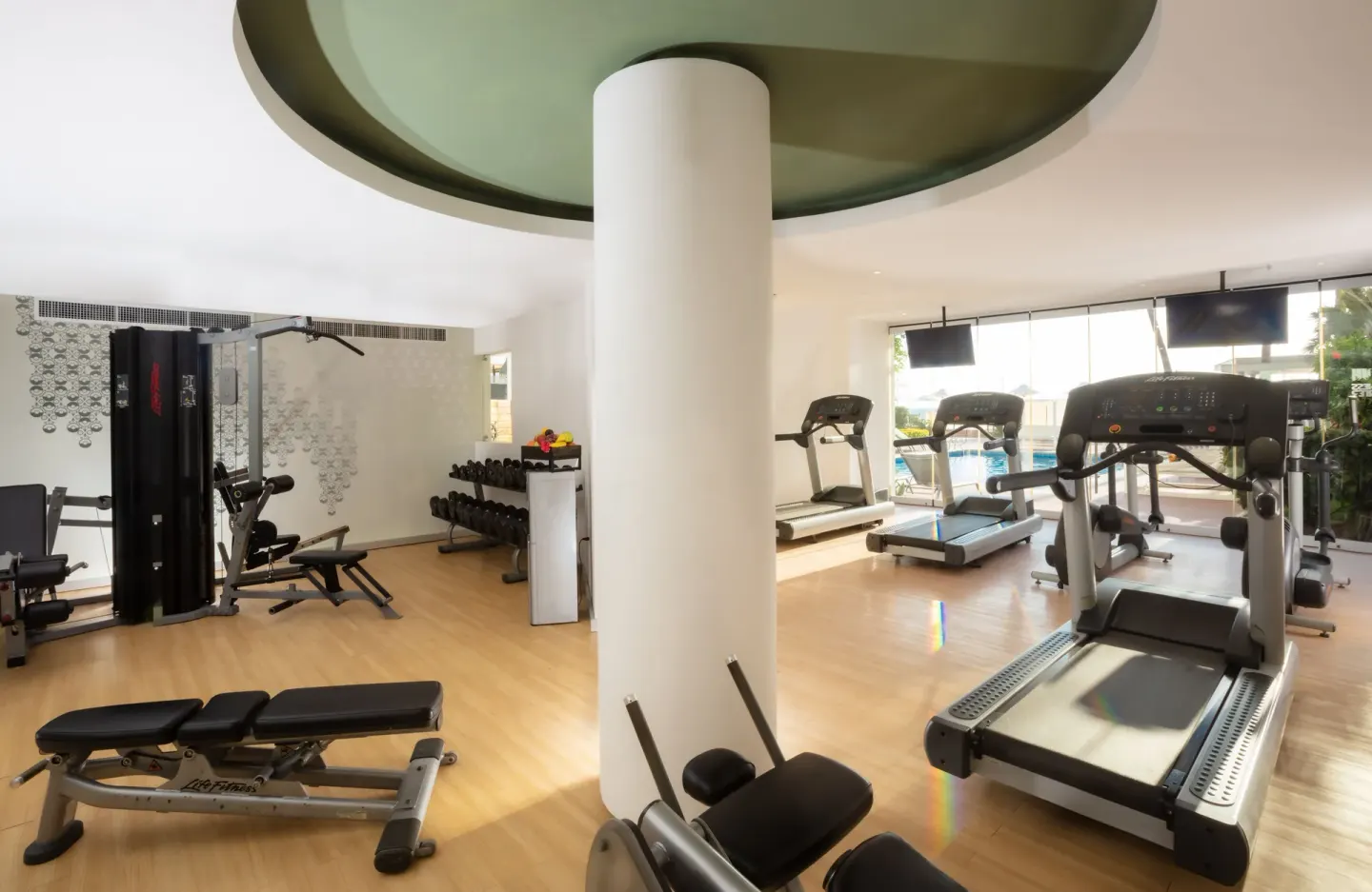 Gym with treadmills and weight machines at Buenaventura Grand Hotel & Great Moments.