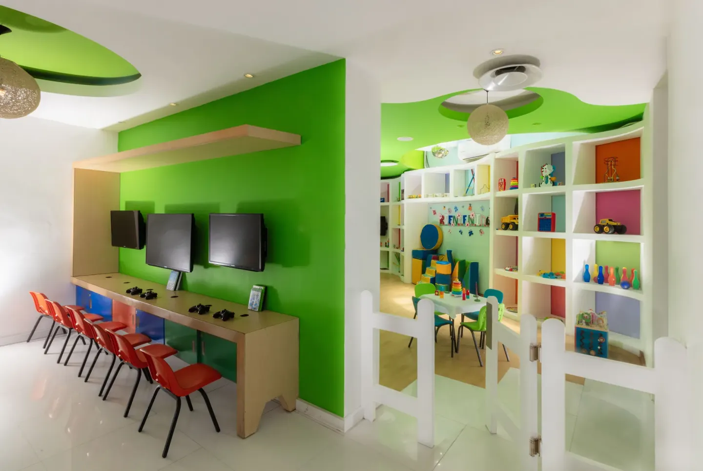 Kids club gaming stations and toy shelves at Buenaventura Grand Hotel & Great Moments.