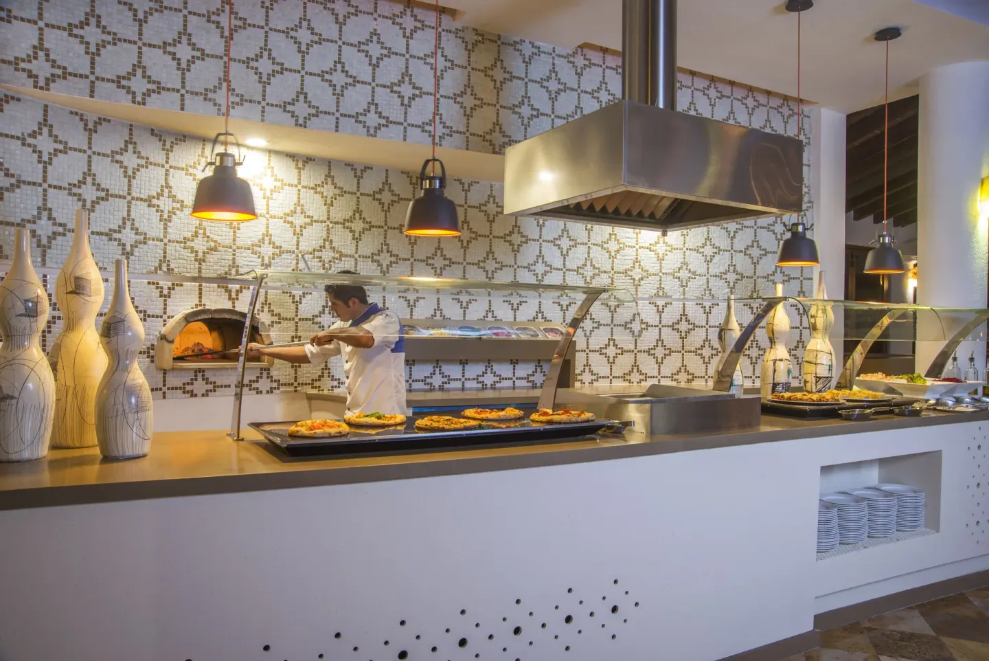 Buffet pizza station with chef and wood-fired oven at Buenaventura Grand Hotel & Great Moments.