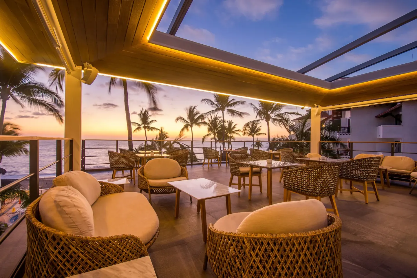 Sunset terrace lounge with ocean views at Buenaventura Grand Hotel & Great Moments.