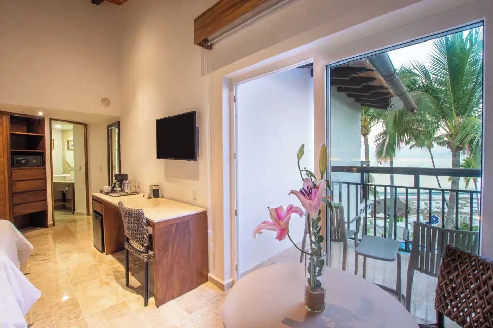 Deluxe Ocean View two-bed room balcony doorway at Buenaventura Grand Hotel & Great Moments.