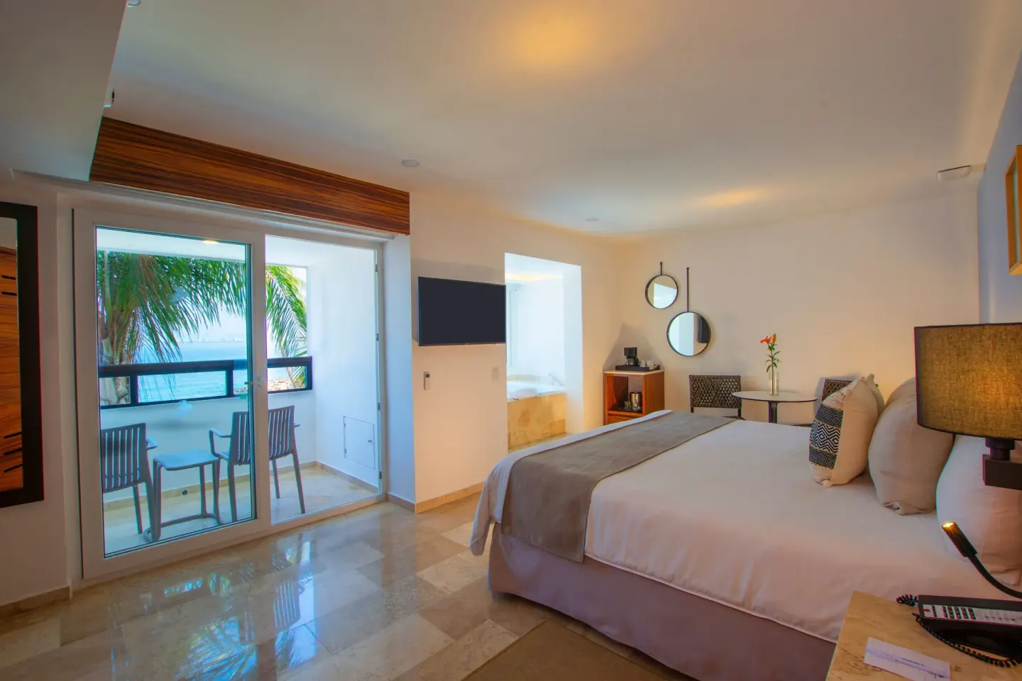 Honeymoon Suite king bed and balcony at Buenaventura Grand Hotel & Great Moments.