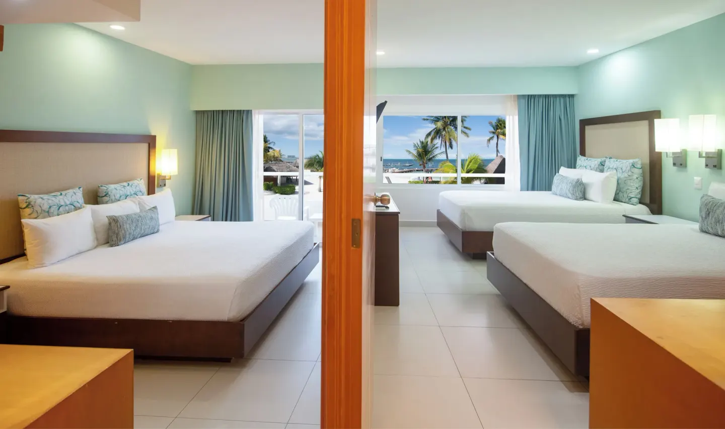 Junior Suite with two bedrooms and ocean-facing windows at Cancun Bay Hotel.