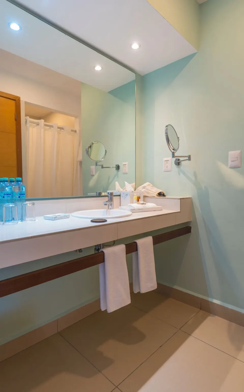 Superior Ocean View bathroom vanity with sink and towels at Cancun Bay Hotel.